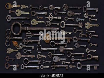 Set of old  antique keys on a gray background Stock Photo