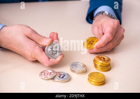 Man earning money via Internet in cryptocurrency concept Stock Photo