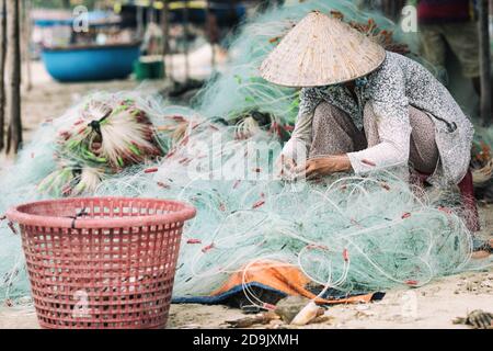 Mui ne fishemans village. Traditional Vietnamese boat in the basket shaped in Fishing village Mui Ne, Vietnam, Asia Stock Photo