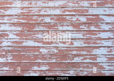 Old, heavily weathered, dusky pink wooden wall Stock Photo