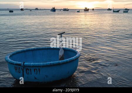 Mui ne fishemans village. Traditional Vietnamese boat in the basket shaped in Fishing village Mui Ne, Vietnam, Asia Stock Photo