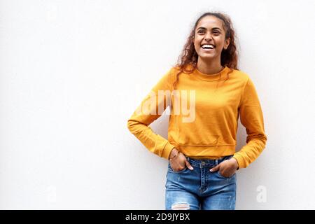 Portrait young indian woman laughing against white background Stock Photo