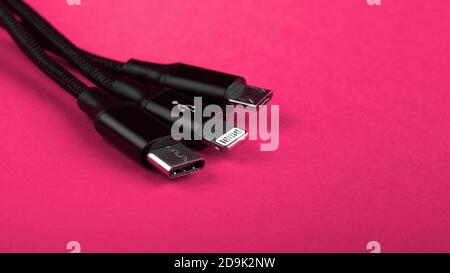 Closeup Shot of Universal USB Cable. 3 different cellphone usb charging plugs adapter from USB Stock Photo