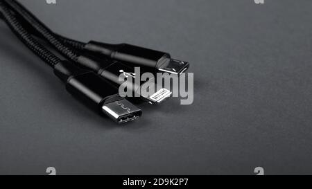 Closeup Shot of Universal USB Cable. 3 different cellphone usb charging plugs adapter from USB Stock Photo