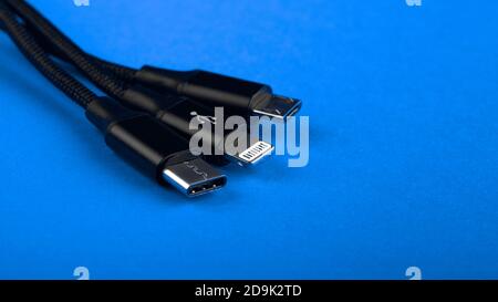 Closeup Shot of Universal USB Cable. 3 different cellphone usb charging plugs adapter from USB Stock Photo