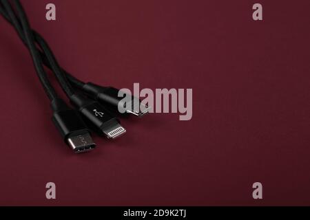 Closeup Shot of Universal USB Cable. 3 different cellphone usb charging plugs adapter from USB Stock Photo