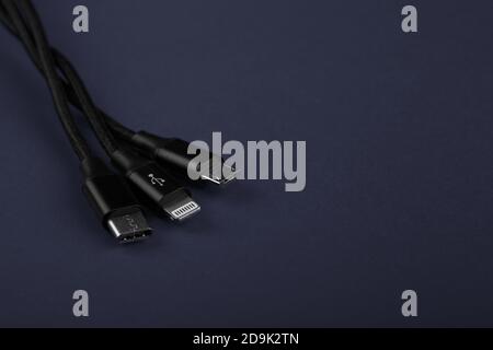 Closeup Shot of Universal USB Cable. 3 different cellphone usb charging plugs adapter from USB Stock Photo