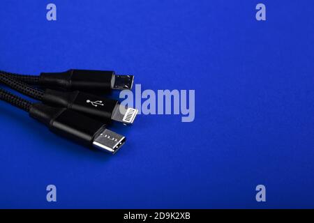 Closeup Shot of Universal USB Cable. 3 different cellphone usb charging plugs adapter from USB Stock Photo
