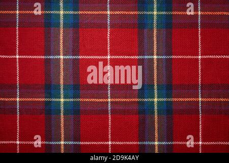 Red tartan plaid material background. Christmas pattern. Stock Photo