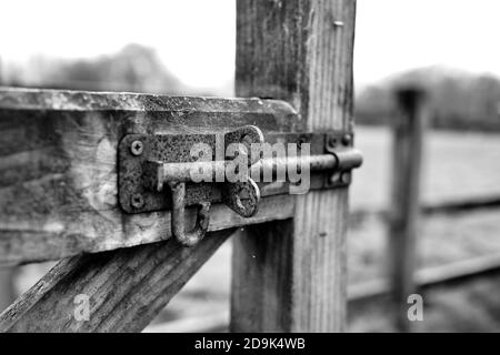 Gate to a field with bolted locking mechanism Stock Photo