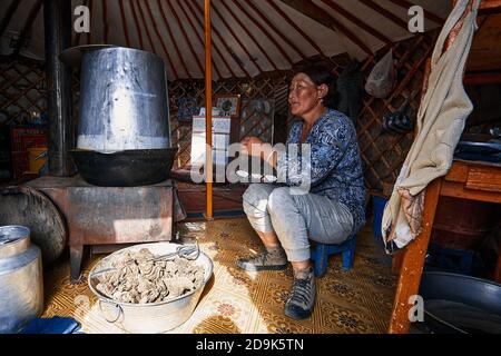 Life of the Mongolian Yurt. Interior of the nomad's house. Mongol family at home. 06.09.2019. Gobi Desert, Mongolia. Stock Photo
