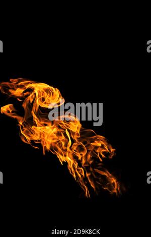Fire flames on black background isolated. Burning gas or gasoline burns with fire and flames. Flaming burning sparks close-up, fire patterns. Infernal Stock Photo