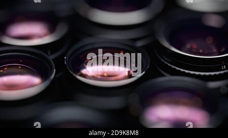 High-aperture camera lenses with reflections, low key image. High-quality photographic lens close photographed. Stock Photo