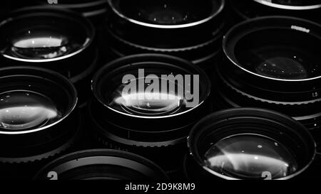 High-aperture camera lenses with reflections, low key image. High-quality photographic lens close photographed. Stock Photo