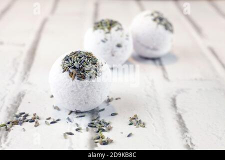 Handmade lavender bath bombs on white brick background Stock Photo