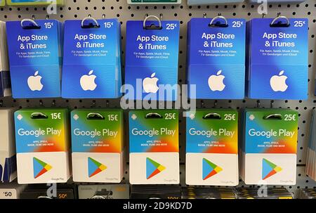 Viersen, Germany - November 4. 2020: Closeup of Apple app store iTunes and  Google Play voucher gift Cards in a row in shelf of german shop Stock Photo  - Alamy