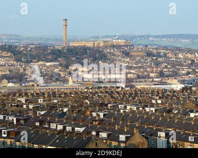 Looking across the rooftops of houses towards Listers Mill in the Yorkshire town of Bradford Stock Photo