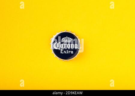 Cap of Corona Extra beer close up. Corona Extra Beer On yellow background. Corona is made in Mexico and is the top selling imported beer in the United Stock Photo