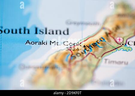 Shallow depth of field focus on geographical map location of Mount Aoraki or Cook in New Zealand Oceania continent on atlas Stock Photo