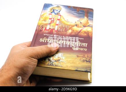 Bhagavad Gita book isolated on white background with selective focus Stock Photo