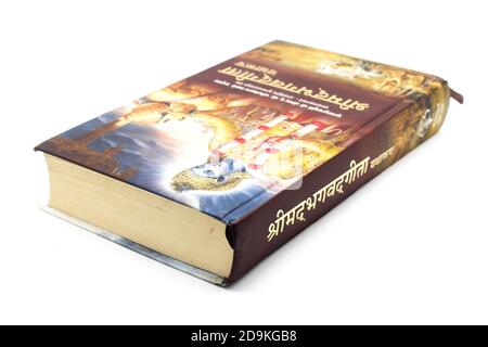 Bhagavad Gita book isolated on white background with selective focus Stock Photo