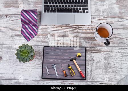 Office workplace and work tools on the tablet screen. Stock Photo