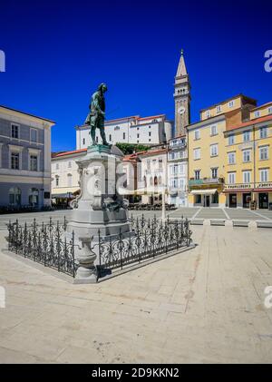 Piran, Istria, Slovenia - Tartini Square with Tartini Monument and St. George Cathedral in the port city of Piran on the Mediterranean. Stock Photo