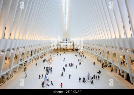 New York City, New York, United States of America - People in the Oculus, main hall of the subway station with shopping center, World Trade Center, Transportation Hub, WTC, architect Santiago Calatrava, Manhattan. Stock Photo