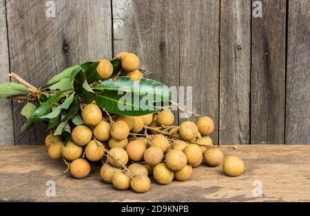 Longan Fresh Dimocarpus longan,on a wooden background. Stock Photo