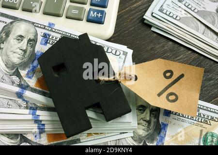 Wooden house and percent of home loan as mark of Interest Rate Percentage. Stock Photo