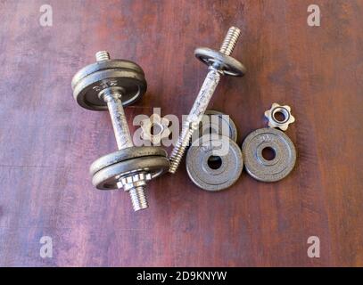 Top view of a dumbbells on a wooden background Stock Photo