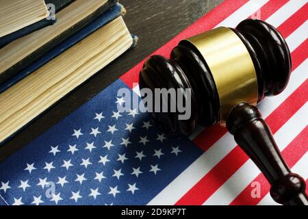 The USA flag and gavel in the court as symbol of Federal judiciary. Stock Photo