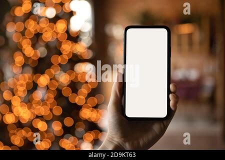 Close up smartphone with empty screen mockup on holiday background Stock Photo