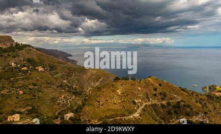 between sky and sea black clouds.Landscape of the Strait of Sicily Stock Photo