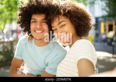 Photo Portrait of African American Girl Pulling Hoodie Strings Laces  Isolated on Vivid Yellow Colored Background Stock Image - Image of black,  multiethnic: 230592381