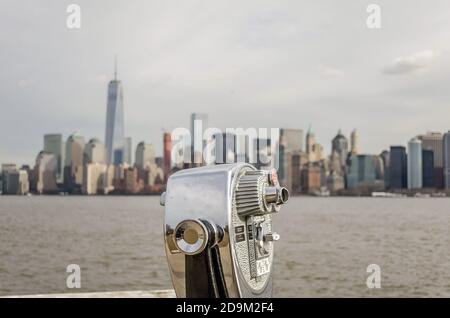 Close up Photo of Coin Operated Binoculars with View in Manhattan Cityscape, Skyscrapers and Towers, New York City, USA Stock Photo