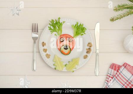 Edible Christmas deer made of vegetables for the festive New Year and Christmas table. Stock Photo