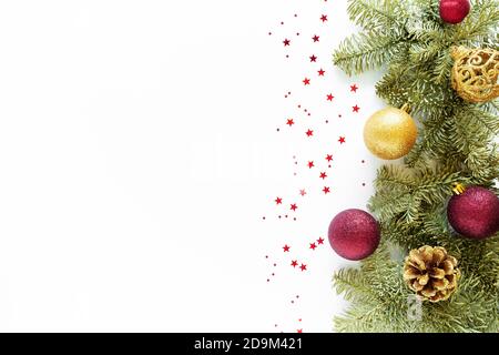 Christmas composition. Christmas balls, pine cones, fir branches on white surface. Flat lay, top view, copy space Stock Photo