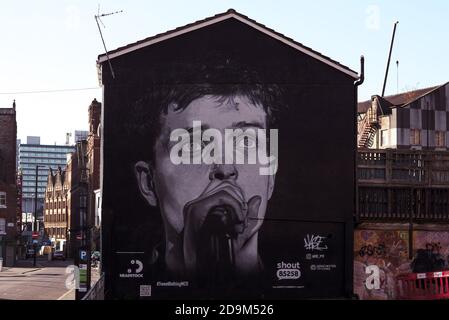Ian Curtis of Joy Division mural in Manchester's Northern Quarter by artist Akse p19. Stock Photo