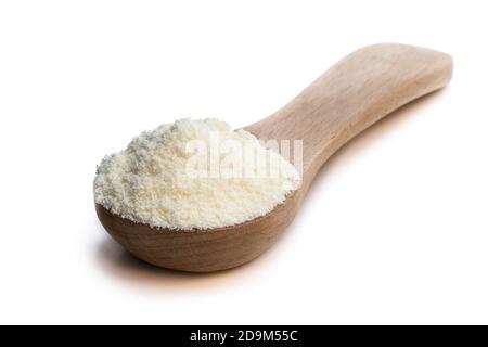 Full  fat powdered milk in wooden spoon isolated on white Stock Photo