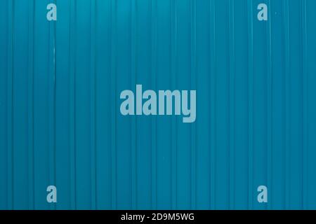 Corrugated wall made of blue metal. Texture of corrugated wall made of blue metal. Stock Photo