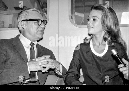 Hollywood couple Cary Grant and Dyan Cannon meet reporters at Southampton Airport in 1966 as the couple arrive in England to visit Grant's mother. Stock Photo