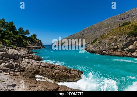 Breathtaking view of the waves and blue sea in Baia di Ieranto, Nerano, Naples Stock Photo