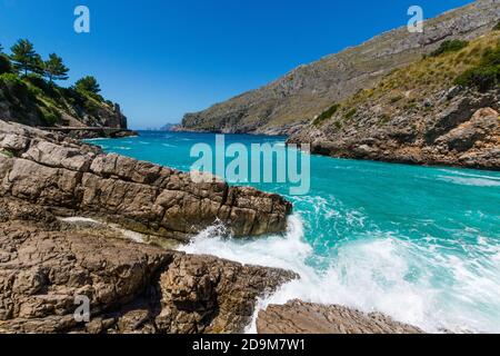 Breathtaking view of the waves and blue sea in Baia di Ieranto, Nerano, Naples Stock Photo