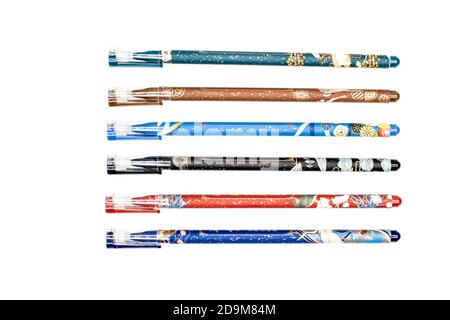 pens in various colors and patterns on a white background Stock Photo