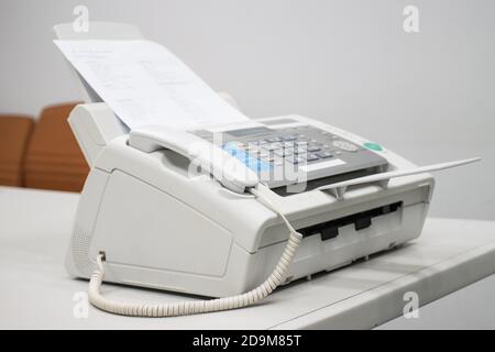 The fax machine for Sending documents in the office concept equipment needed in office Stock Photo