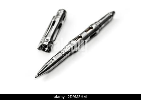 Titanium Tactical Ballpoint Pen on white background Stock Photo