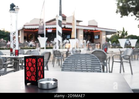 Belek, Turkey - October 2020: Empty cafe in a hotel during coronavirus pandemic. Half-filled hotel, almost no people hanging out outside. Nobody. Stock Photo