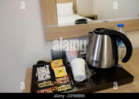 Belek, Turkey - October 2020: Using plastic cups instead of ceramic in hotel room. All inclusive resort with safety measures to prevent epidemic Stock Photo