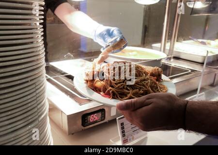 Belek, Turkey - October 2020: Huge dinner portions in an all-inclusive resort in Antalya. Healthy safety measures during coronavirus outbreak pandemic Stock Photo